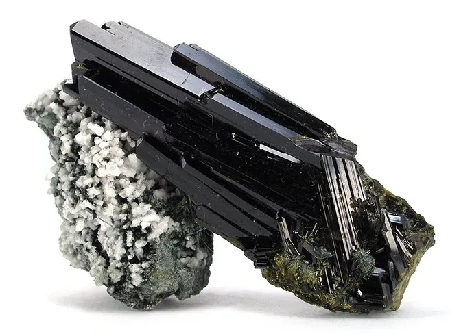 Epidote is a highly versatile mineral that is commonly found in metamorphic and igneous rocks.